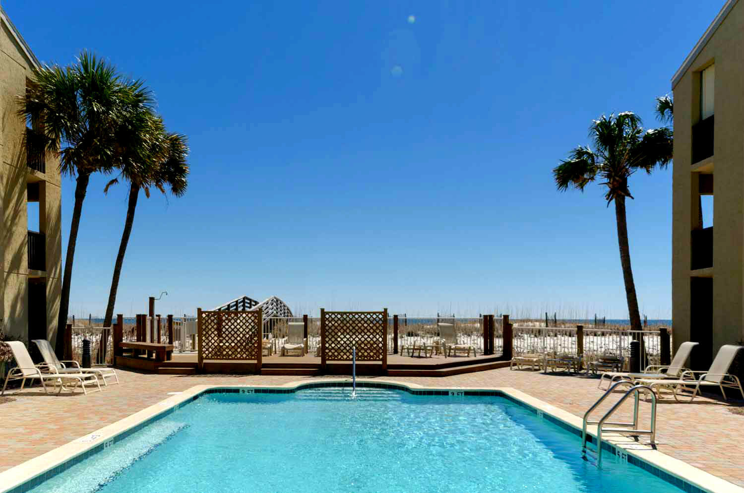 Swim some laps in the outdoor pool at Shipwatch condos in Perdido Key